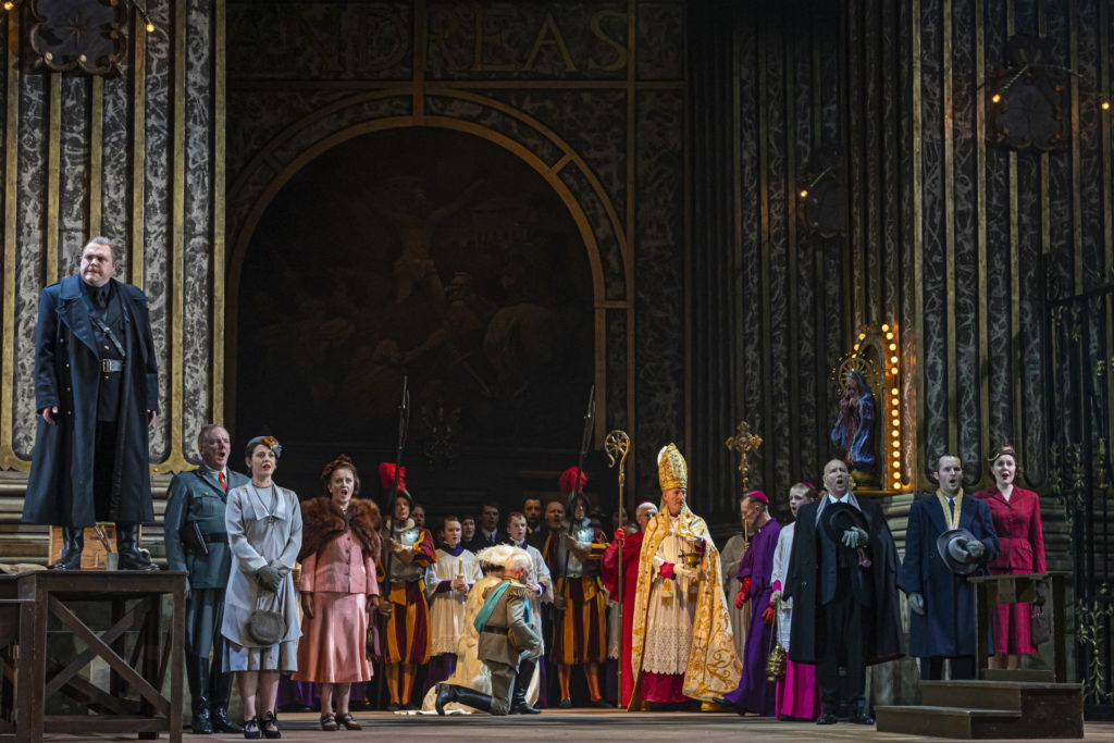 Roland Wood as Scarpia and the cast of Tosca. Scottish Opera 2019. Credit James Glossop.